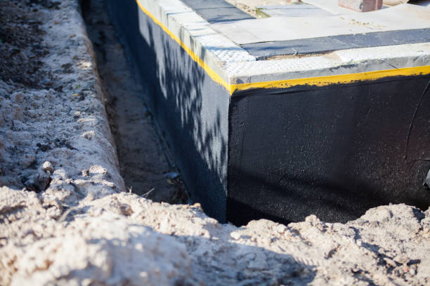 Professional Basement Waterproofing technician working in Duck River, TN